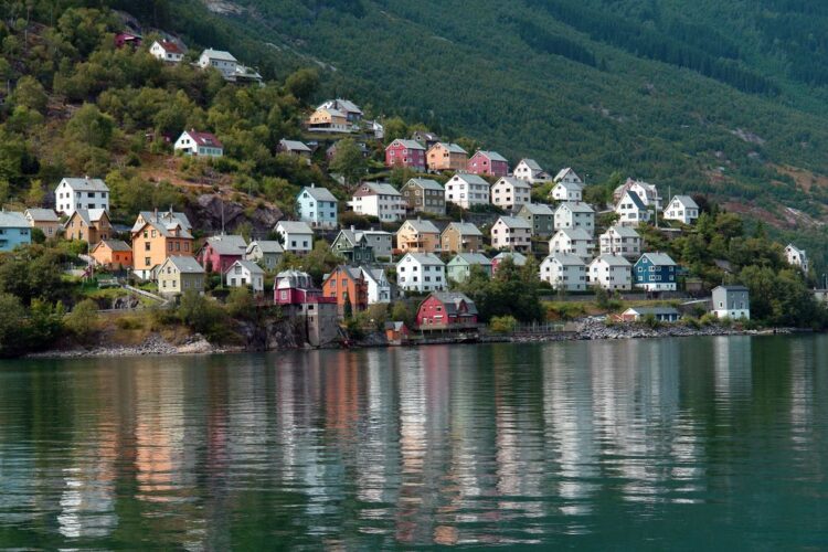 Norwegian fjord landscape in summer with mountains and calm water