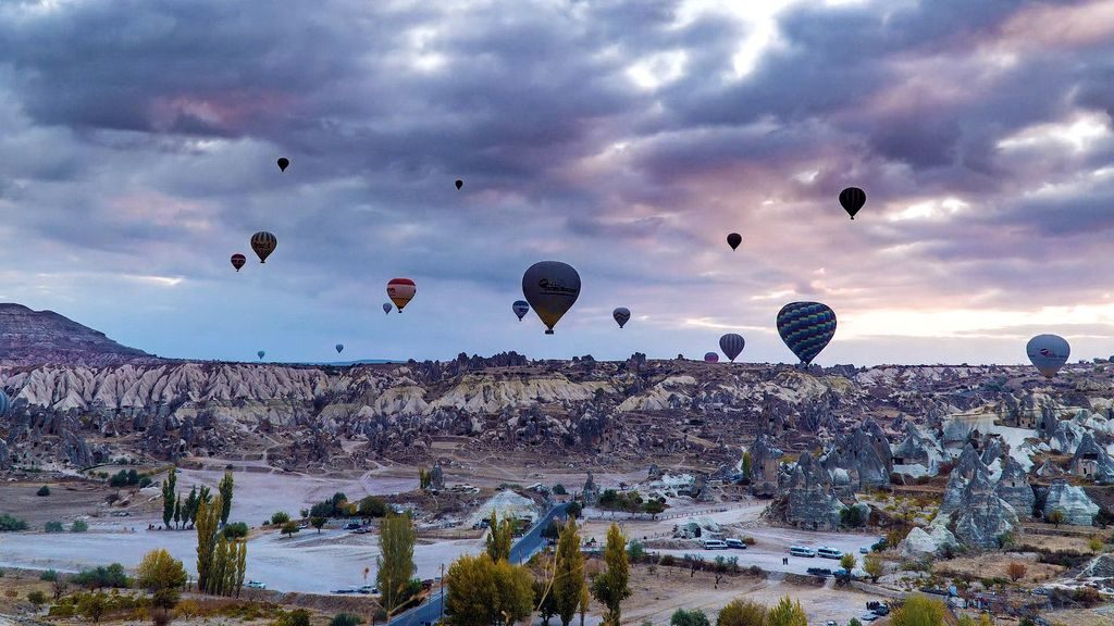 Hot air balloons over Cappadocia at sunrise