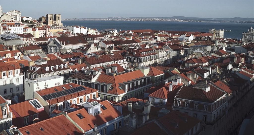 Panoramic view of Lisbon cityscape with red roofs