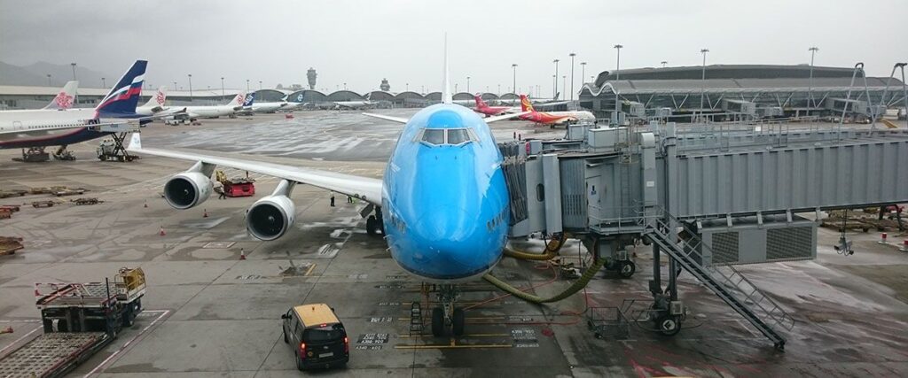 Airplane parked at the terminal gate with airstairs attached