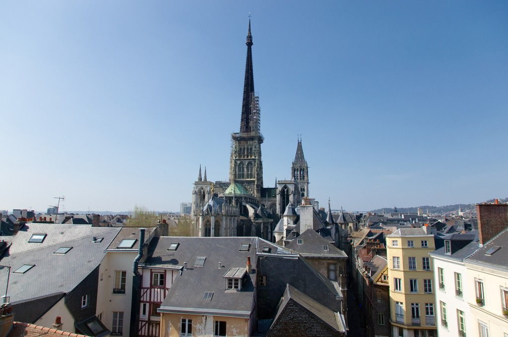 Gothic facade of Rouen Cathedral, the tallest church in France, on a sunny day
