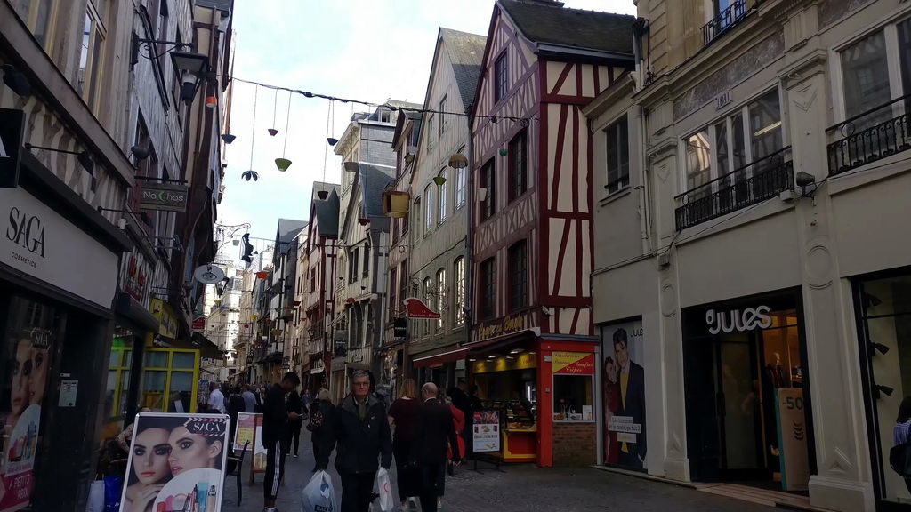Charming medieval half-timbered buildings along a cobblestone street in Rouen