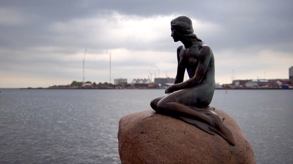 The Little Mermaid bronze statue on a rock at Langelinie pier