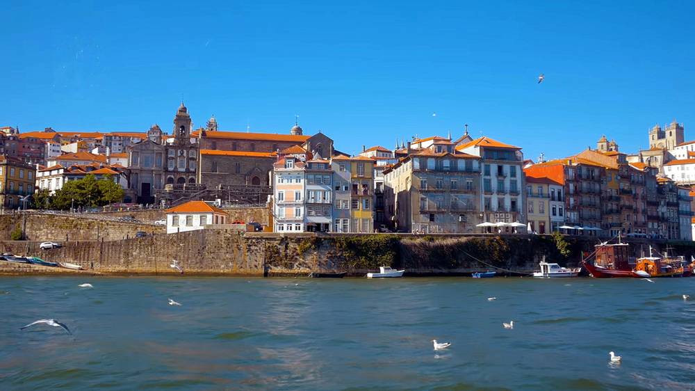 View of the UNESCO-listed Ribeira waterfront and Dom Luís I Bridge in Porto