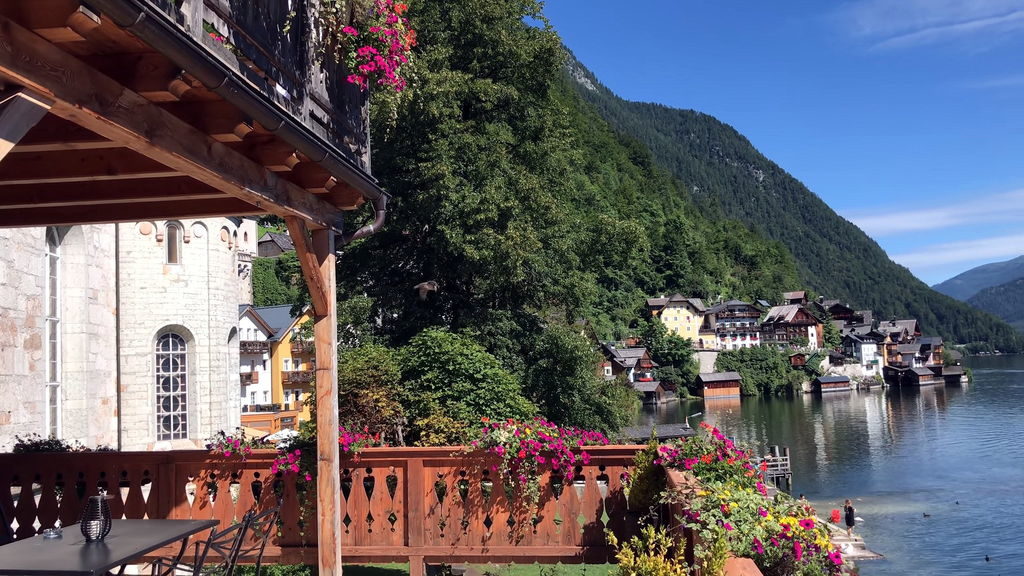 View of Hallstatt Austria and Alps reflected in lake water