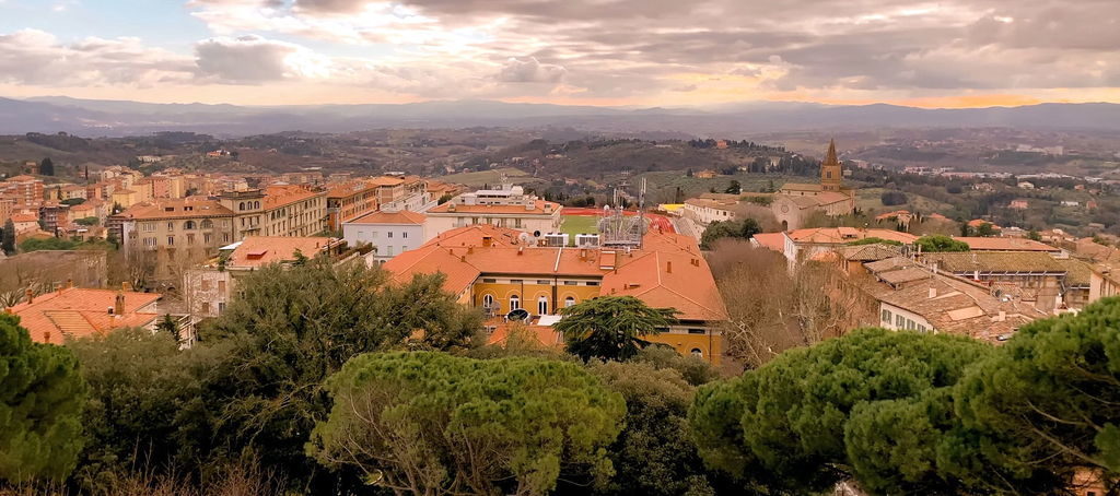 Scenic view of Perugia at sunset with medieval architecture