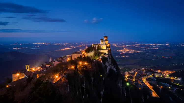 San Marino at night - illuminated medieval towers and cityscape