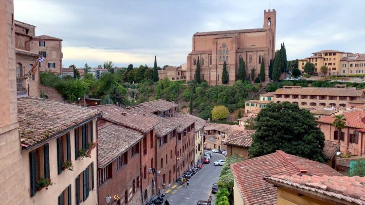 Medieval town square in Siena Italy with historic brick buildings