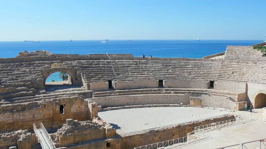 Ancient Roman amphitheater in Tarragona overlooking the Mediterranean Sea at sunset