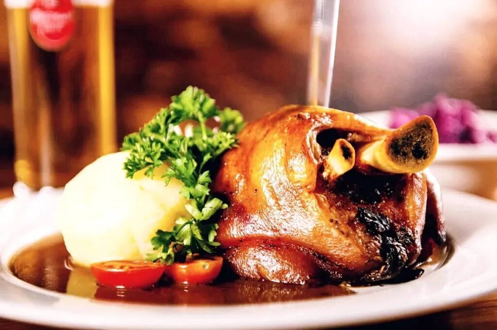 Crispy Berlin-style Eisbein with sauerkraut and potatoes=