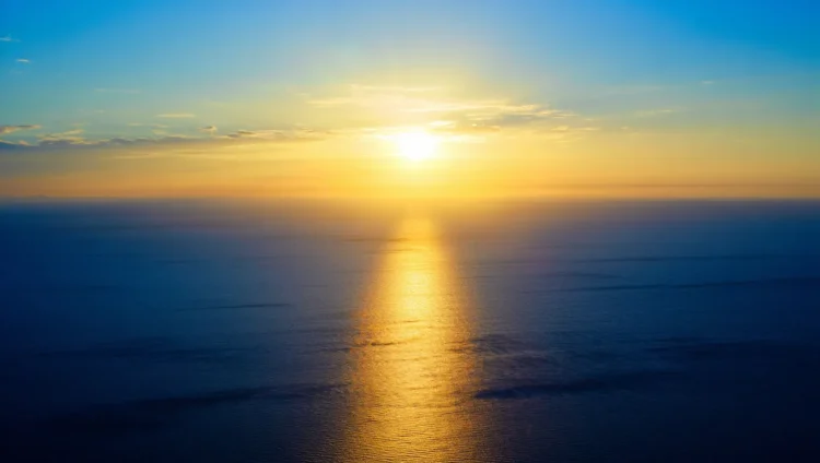 Sunset over the ocean revealing the Sun's true color