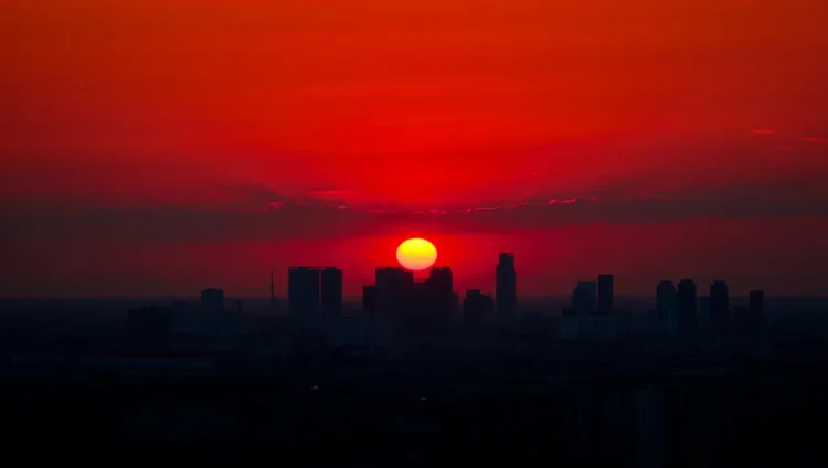 Vibrant red sunset indicating windy weather