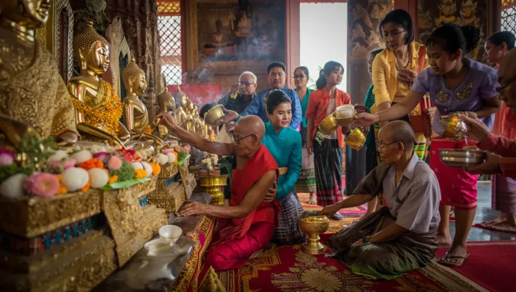 Songkran water festival celebration in Thailand with people splashing water